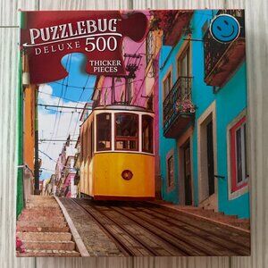 3/$10 500 Piece Puzzle "TRAM IN LISBON, PORTUGAL"